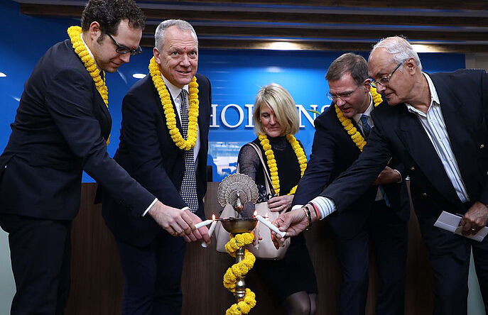 Hohenstein employees cutting ribbon at lab opening ceremony
