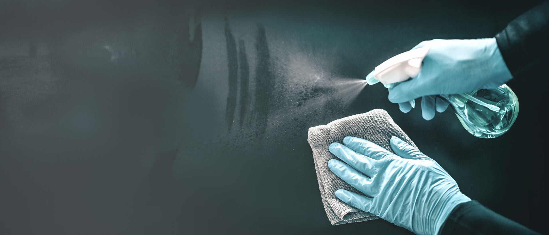 Technician wearing gloves testing disinfectant application on flexible medical material in a lab setting